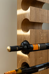 Close up view of the solid oak wine rack VALGE for six bottles highlighting the wood grain