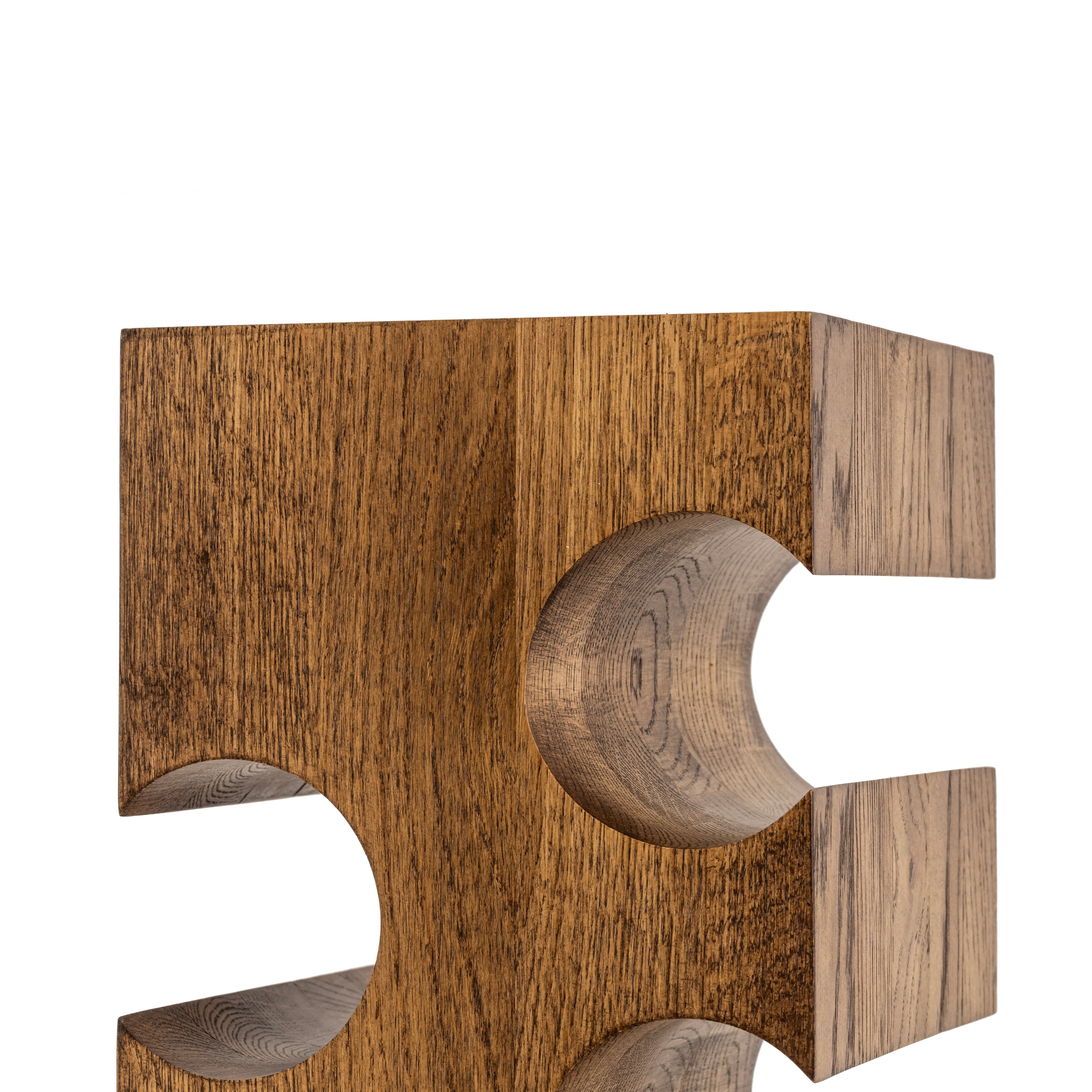 Close up view of the solid wood wine rack for twelve bottles on a white background highlighting the natural oak wood grain
