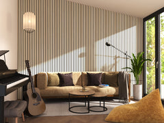 A modern living room featuring natural Wooden slat panels, two round coffee tables, a couch, a piano and a guitar