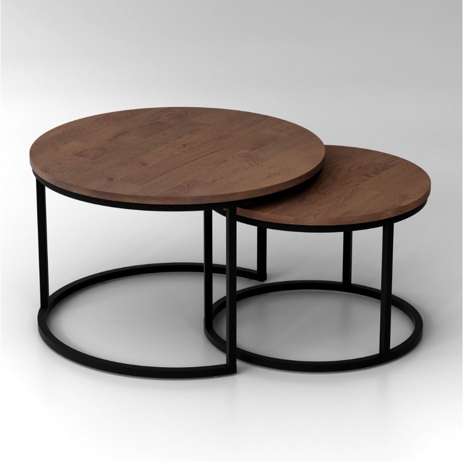Rukilill round coffee table set with black metal legs and dark oak table top on white background